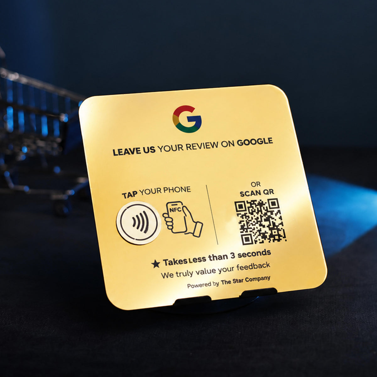 Real photo of the 22K gold Google review plaque next to a payment terminal