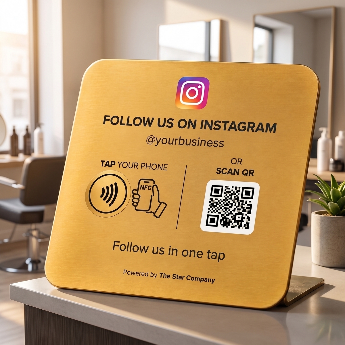 22K gold Instagram Follow Plate on a hair salon reception desk, NFC tap and QR code to follow on Instagram
