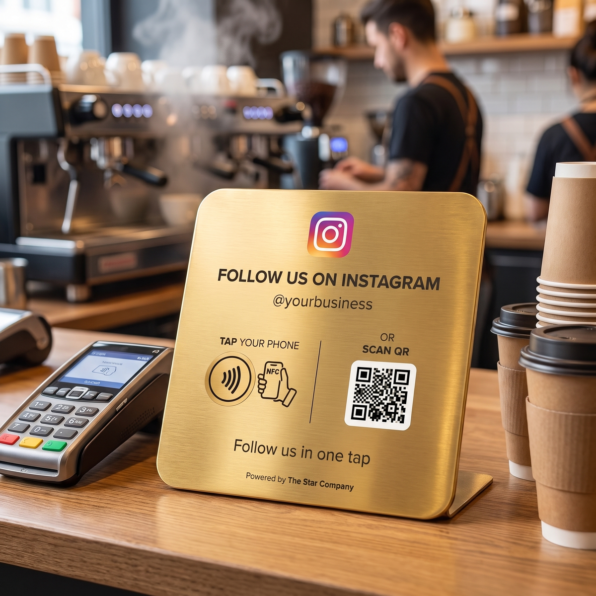 Gold Instagram Follow Plate on a coffee shop counter beside a card payment terminal